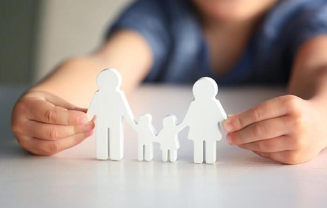 kid holding family blocks